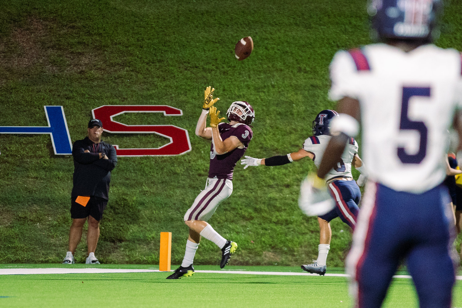 Cinco Ranch’s Seth Salverino makes a catch for a touchdown during Friday’s game between Cinco Ranch and Tompkins at Rhodes Stadium.